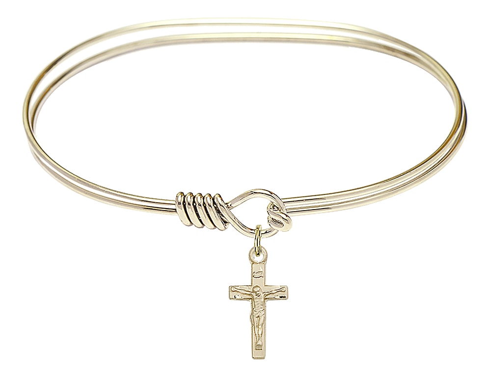 The bracelet is a Hamilton Gold 7 inch Oval Eye Hook Bangle Bracelet  The charm is a 14kt Gold Filled Crucifix  The charm measures 1/4-inch tall and 5/8-inch wide Handmade in the USA