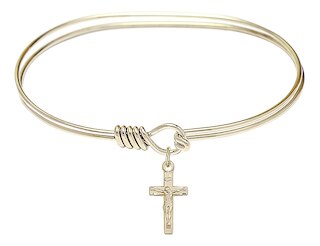 The bracelet is a Hamilton Gold 7 inch Oval Eye Hook Bangle Bracelet  The charm is a 14kt Gold Filled Crucifix  The charm measures 1/4-inch tall and 5/8-inch wide Handmade in the USA
