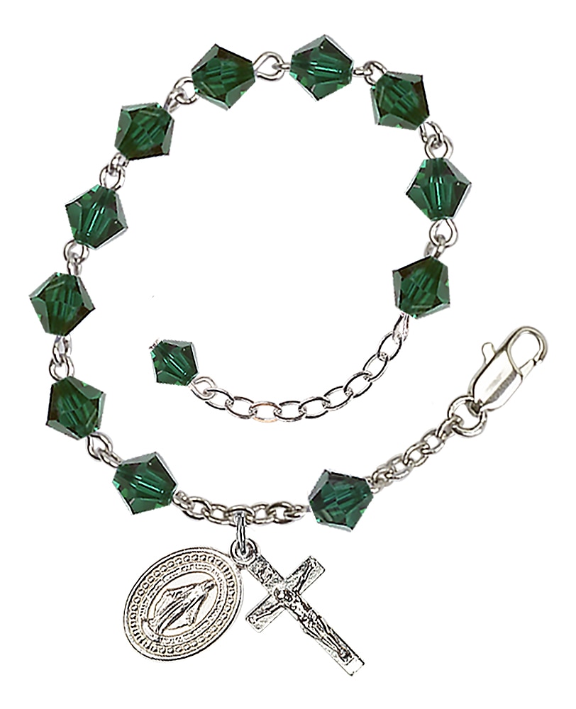 Rosary bracelet is Silver-Plated and can be adjusted between 7 1/2 and 8 1/2-inches   Beads are 6mm Dark Green, bi-cone shaped, Austrian Crystal   Crucifix is 7/8-inch tall by 3/8-inch wide   Miraculous Medal is 1/2-inch tall by 1/4-inch wide Handmad